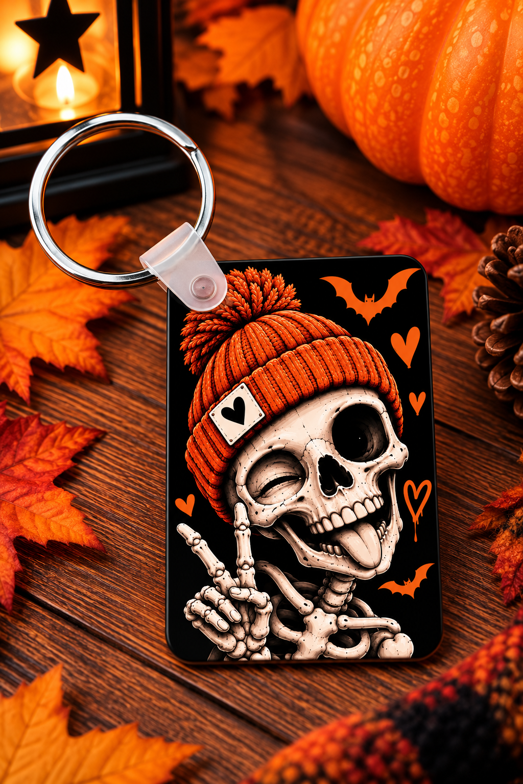 Orange beanie skeleton Halloween keychain with spooky seasonal design
