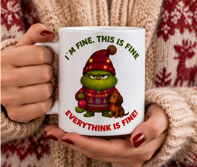 Funny Christmas ceramic mug held in hands with grumpy holiday character design
