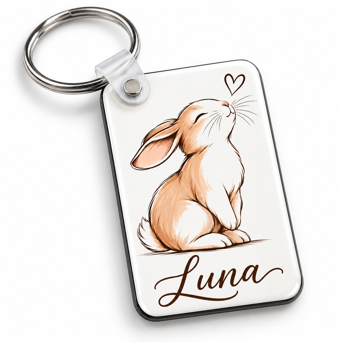 Personalized bunny keychain with custom name shown from an angle